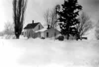 1940's Moon House behind the pine tree and windmill which still stand today.